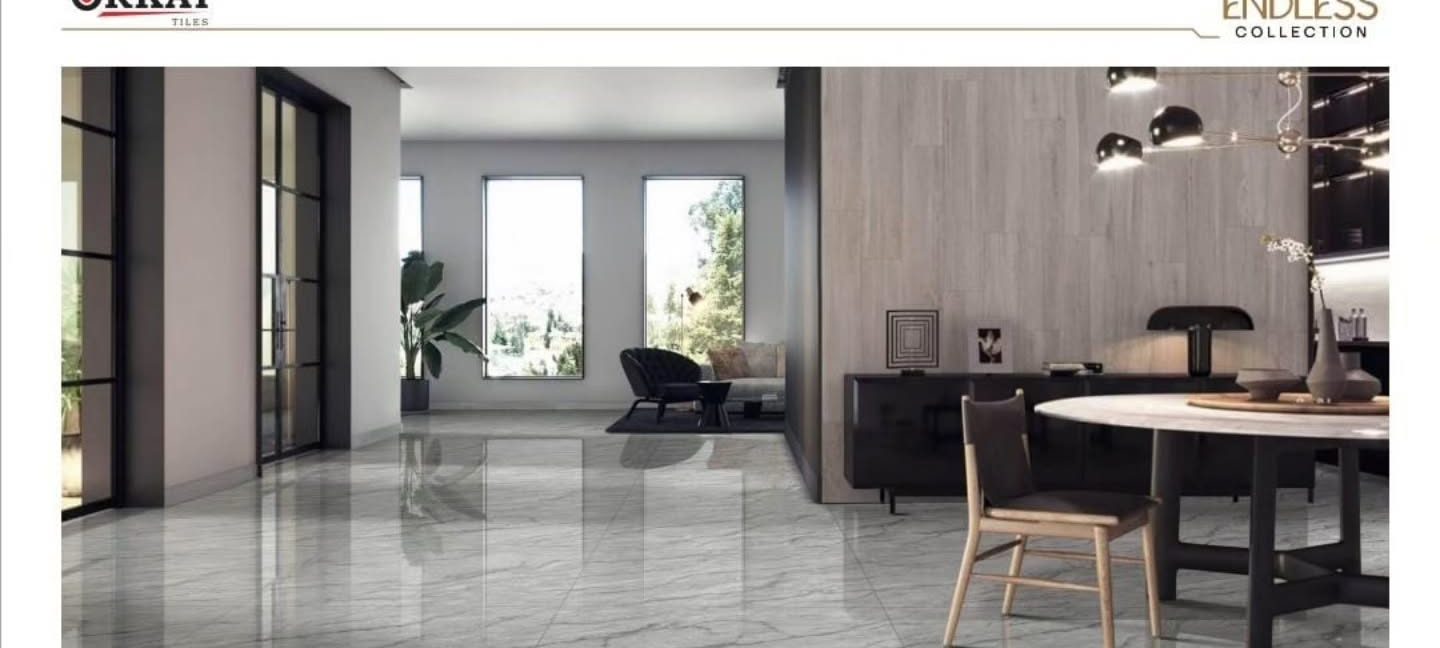 Open-plan living room with glossy grey marble-look floor
