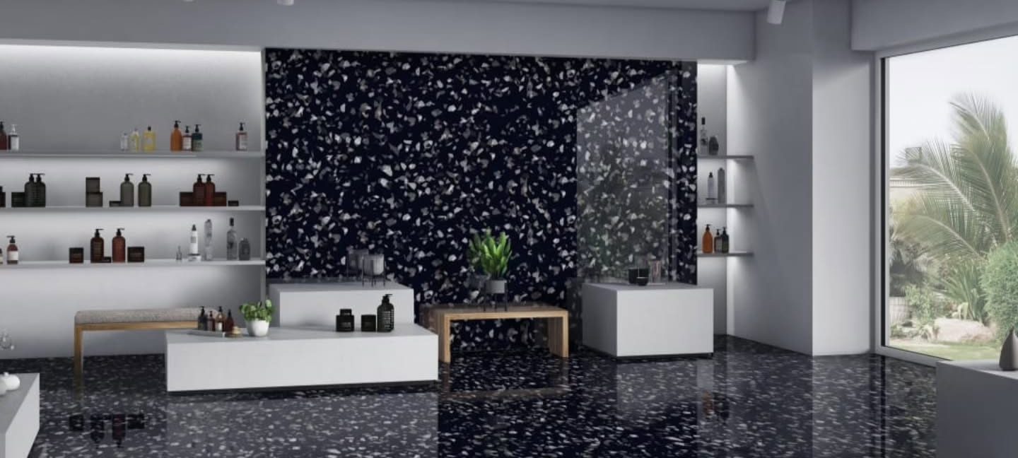 Retail interior with black terrazzo floor and feature wall